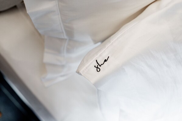 A white fabric with a handwritten signature. - She Mykonos- Luxury Apartments (Mykonos)