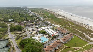 Enjoy scenic ocean views from the comfort of our resort, surrounded by lush greenery and a sandy beach.