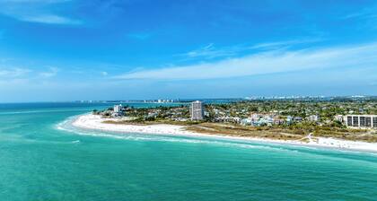 Perfect location Walk to the village and beach Private Balcony Heated Pool