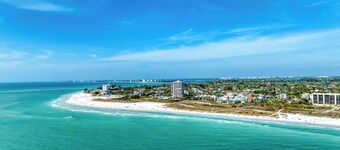 Perfect location Walk to the village and beach Private Balcony Heated Pool