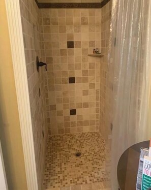 Shower, towels, soap, toilet paper