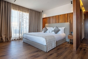 Suite Executive | Biancheria da letto di alta qualità, minibar, una cassaforte in camera