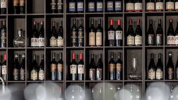 A wall of wine bottles in a wine cellar.