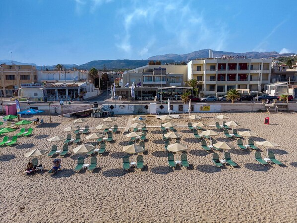 On the beach, white sand, sun loungers, beach umbrellas - Princess Irini Sea Front (Rethymno)