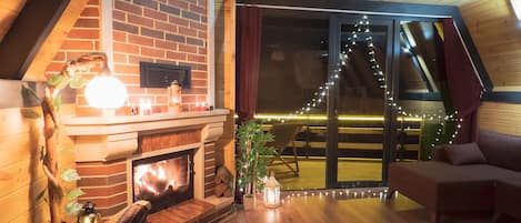 Sana Room | Living area | 80-inch LED TV with satellite channels, TV, fireplace