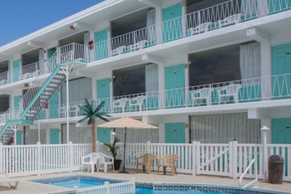 Seasonal outdoor pool, open 9:30 AM to 6:30 PM, pool umbrellas