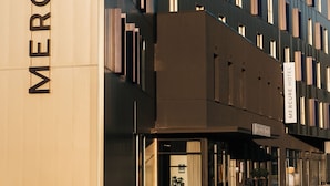 A modern hotel building with a prominent sign reading "Mercure Hotel". - Mercure Brest Centre Port (Brest)