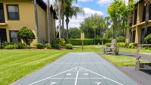A shuffleboard court with numbered scoring areas and a 'OFF' zone.