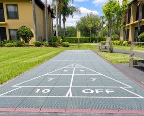 A shuffleboard court with numbered scoring areas and a 'OFF' zone.