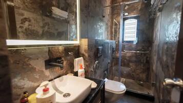 Shower, hair dryer, towels, soap