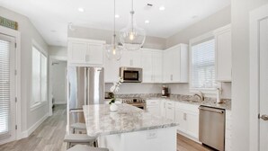 House, 4 Bedrooms | Private kitchen - 5509 Thomas Drive by Forehand Rentals (Panama City Beach)