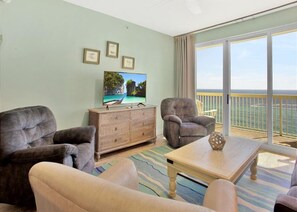 Condo, 3 Bedrooms | Living room | TV - Calypso 1104 East by Forehand Rentals (Panama City Beach)