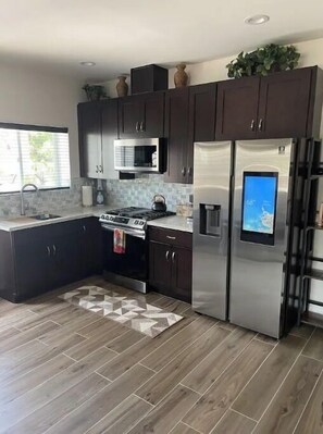 Microwave, oven, coffee/tea maker, cookware/dishes/utensils