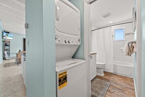 Combined shower/tub, hair dryer, towels, soap