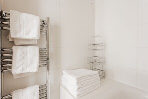 Combined shower/tub, hair dryer, towels, soap