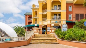 A hotel entrance with a café, a Wyndham Center sign, and a pool area. - Destin | Group Emerald Coast Getaway | Pool + Beach | 4BR Sleeps 10 (Destin)