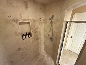 Bathtub, towels, soap, shampoo
