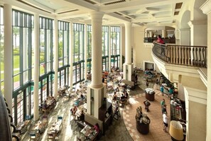 Experience the grandeur of our atrium, featuring high ceilings, large windows, and elegant columns.
