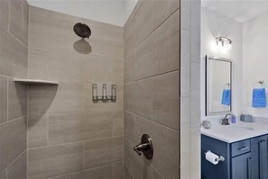 Shower, hair dryer, towels, toilet paper