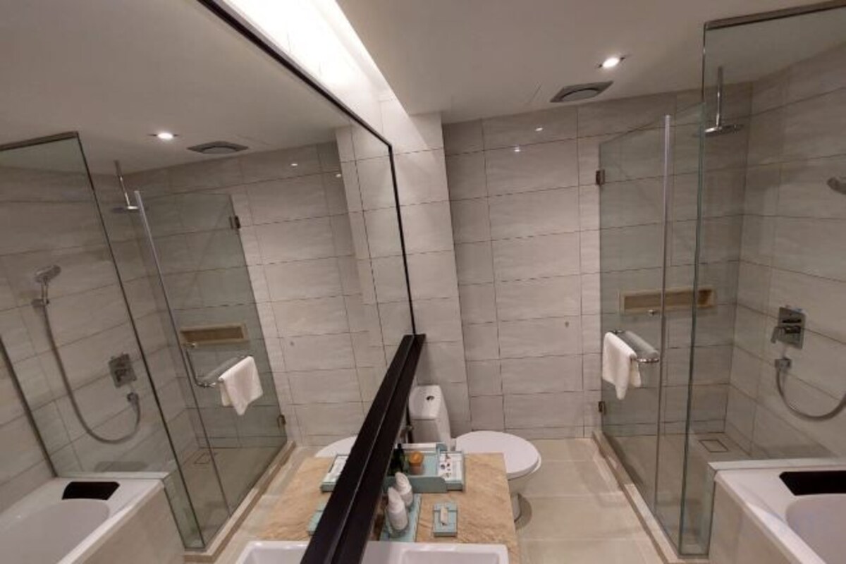 Separate tub and shower, rainfall showerhead, free toiletries