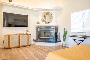Bonus room off the kitchen with another grand Smart TV. (fireplace not in use)