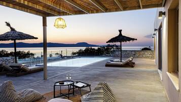 A heated pool, pool loungers