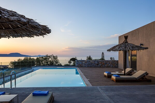 A heated pool, pool loungers