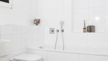 Bathtub, hair dryer, towels