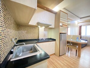 Fridge, stovetop, cookware/dishes/utensils