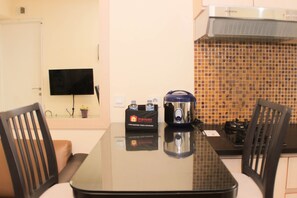 Fridge, stovetop, cookware/dishes/utensils - Nice And Comfy 2Br At Bassura City Apartment (Jakarta)