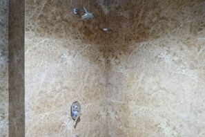 Shower, free toiletries, towels, shampoo - Serene Exclusive Modern Studio Apartment At Grand Sungkono Lagoon (Surabaya)