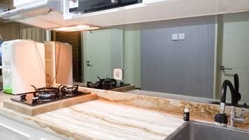 Fridge, microwave, stovetop, cookware/dishes/utensils