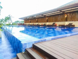 Outdoor pool - Warm And Cozy Studio At Azalea Suites Apartment (Cikarang)