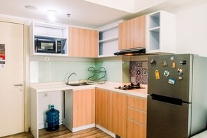 Fridge, stovetop, cookware/dishes/utensils - Elegant 2Br Apartment At M-Town Residence Near Summarecon Mall (Gading Serpong)