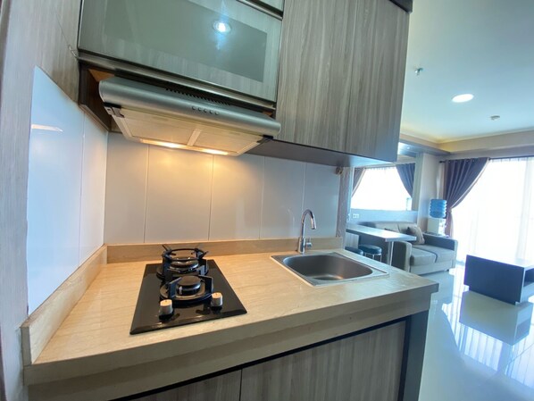 Fridge, stovetop, cookware/dishes/utensils - Spacious And Modern 2Br At Gateway Pasteur Apartment (Cimahi)