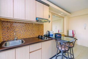 Fridge, stovetop, cookware/dishes/utensils - Strategic 2Br Apartment At Bassura City (Jakarta)