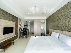 1 bedroom, free WiFi, bed sheets - Deluxe Studio Room At Dago Suites Apartment (Bandung)