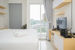 Room | Living area | TV - Fancy And Nice Studio At Skylounge Tamansari Apartment (Tangerang)