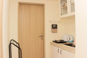 Fridge, stovetop, cookware/dishes/utensils - Warm And Cozy Living 3Br At Meikarta Apartment (Cikarang)