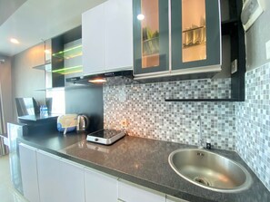 Fridge, stovetop, cookware/dishes/utensils - Minimalist And Affordable Studio Apartment At Taman Melati Jatinangor (Hegarmanah)