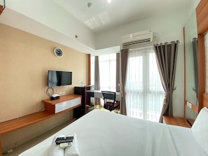 TV - Monochrome Studio Room At Taman Melati Jatinangor Apartment (Hegarmanah)