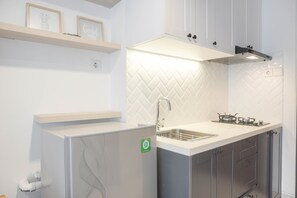 Fridge, stovetop, cookware/dishes/utensils - Cozy Stay And Spacious Studio At West Vista Apartment (Jakarta)