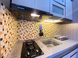 Fridge, stovetop, cookware/dishes/utensils - Best Deal 1Br Apartment At Parahyangan Residence Bandung (Bandung)