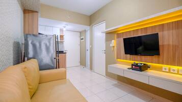 Quarto | Área de estar | TV