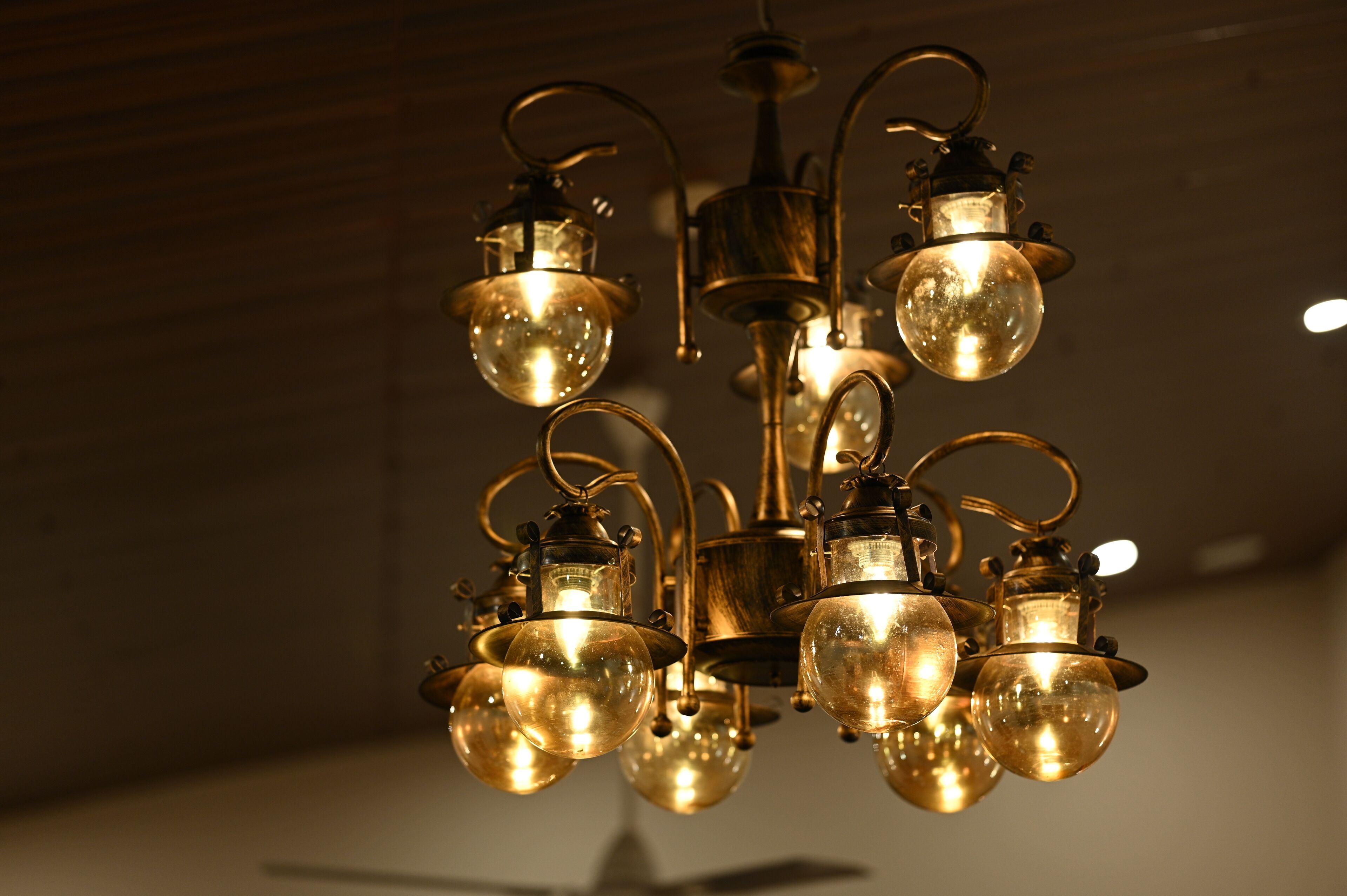 A chandelier with multiple spherical glass bulbs and metal fixtures.