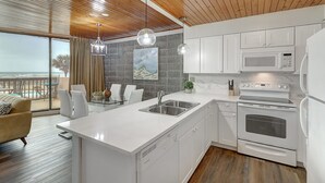 Coffee/tea maker, fridge, microwave, oven