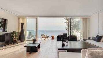 Royal Villa, 4 Bedrooms, Private Pool, Sea View | Living room | Smart TV, fireplace, heated floors