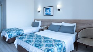A hotel room with two beds, a chair, a nightstand, and a painting on the wall. - FİLA OTEL AYVALIK (Ayvalik)