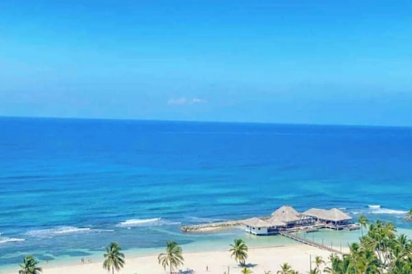 On the beach, sun loungers, beach towels
