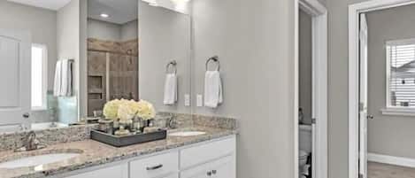 Combined shower/tub, hair dryer, towels, soap